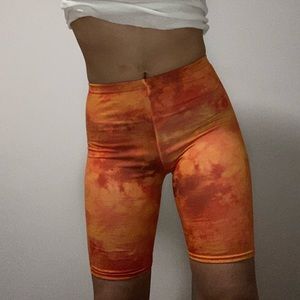 PrettyLittleThing orange tie dye biker shorts